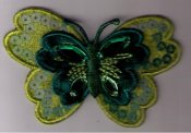Fjäril, grön. 70 mm x 40 mm